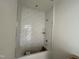 New bathtub with tiled walls and built in shelf, awaiting final fixtures at 771 Old Station Pointe, Angier, NC 27501