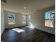 Bright bedroom with hardwood floors and large windows, offering ample natural light at 771 Old Station Pointe, Angier, NC 27501