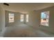 Spacious bedroom with three large windows offering ample natural light and views of the landscape at 771 Old Station Pointe, Angier, NC 27501