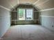 Attic bedroom with drywall, ready to be customized, and showcasing two windows at 771 Old Station Pointe, Angier, NC 27501