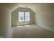 Bright bedroom features unfinished floors and windows, offering customization and bright sunlight at 771 Old Station Pointe, Angier, NC 27501