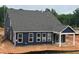 New construction shows the home's siding, roof, and white-trimmed windows at 771 Old Station Pointe, Angier, NC 27501