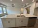 Large kitchen island with sink and stainless steel dishwasher at 771 Old Station Pointe, Angier, NC 27501