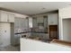 Spacious kitchen with white shaker cabinets ready for counter installation at 771 Old Station Pointe, Angier, NC 27501