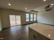Bright, open living room with hardwood floors and large windows at 771 Old Station Pointe, Angier, NC 27501
