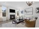 Cozy living room with fireplace, recessed lighting, and large windows for plenty of natural light at 771 Old Station Pointe, Angier, NC 27501