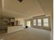 Bright, open-concept living space featuring large windows and a kitchen island, ready for customization at 771 Old Station Pointe, Angier, NC 27501