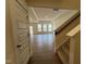 Spacious living room with hardwood floors, tray ceiling, recessed lighting and large windows at 771 Old Station Pointe, Angier, NC 27501