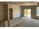 Unfinished living room with sliding door and large windows, awaiting personal touches at 771 Old Station Pointe, Angier, NC 27501