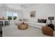 Versatile living space with a large sectional couch, natural light, and soft carpeting at 771 Old Station Pointe, Angier, NC 27501
