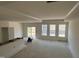Bright, open living space with tray ceilings and access to the outdoors at 771 Old Station Pointe, Angier, NC 27501