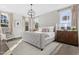 Elegant main bedroom with natural light, a contemporary chandelier, and neutral decor at 771 Old Station Pointe, Angier, NC 27501