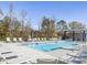 Community pool with ample lounge seating and shaded picnic area for relaxing and enjoying the outdoors at 771 Old Station Pointe, Angier, NC 27501