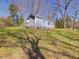 Exterior of home with a small porch and trees at 774 Cornelius St, Hillsborough, NC 27278
