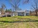 Exterior of home with detached carport and trees at 774 Cornelius St, Hillsborough, NC 27278