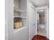 Hallway with built in shelving and door to bathroom at 774 Cornelius St, Hillsborough, NC 27278