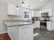 Bright kitchen features granite countertops, stainless steel appliances, and ample cabinet space at 774 Cornelius St, Hillsborough, NC 27278
