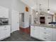 Open-concept kitchen with island, granite countertops, stainless appliances, and view of fireplace at 774 Cornelius St, Hillsborough, NC 27278