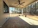 Covered back porch overlooking a wooded lot, offering a serene outdoor space at 7808 Ailesbury Rd, Wake Forest, NC 27587