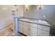 Bathroom featuring modern white vanity with gray countertop and tiled shower at 7808 Ailesbury Rd, Wake Forest, NC 27587