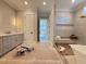 New construction primary bathroom with double vanity, soaking tub, and tiled shower with bench at 7808 Ailesbury Rd, Wake Forest, NC 27587