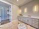 Bathroom featuring custom cabinets, and sinks, and a walk-in closet at 7808 Ailesbury Rd, Wake Forest, NC 27587