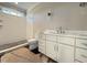 Bathroom showcasing a walk-in shower, white vanity, and modern fixtures at 7808 Ailesbury Rd, Wake Forest, NC 27587