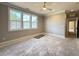 Bedroom with hardwood floors, large windows, and neutral paint provides ample natural light at 7808 Ailesbury Rd, Wake Forest, NC 27587