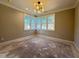 Spacious bedroom features hardwood floors, large windows, and contemporary lighting at 7808 Ailesbury Rd, Wake Forest, NC 27587