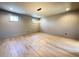 Bright room with hardwood floors, large windows, and contemporary lighting at 7808 Ailesbury Rd, Wake Forest, NC 27587
