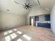 Spacious living room with vaulted ceiling, recessed lighting, and a sleek wet bar at 7808 Ailesbury Rd, Wake Forest, NC 27587
