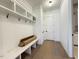 Well-organized mudroom with built-in bench, coat hooks, and storage shelves at 7808 Ailesbury Rd, Wake Forest, NC 27587