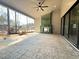 Covered patio with a fireplace, patterned concrete, and a view of the surrounding landscape at 7808 Ailesbury Rd, Wake Forest, NC 27587