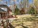 Spacious backyard with deck, mature trees and well maintained lawn at 8000 N Bridgewater Ct, Raleigh, NC 27615