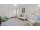 Bright bedroom with a white crib and matching chair at 8000 N Bridgewater Ct, Raleigh, NC 27615