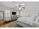 Bright bedroom with lots of natural light and a ceiling fan at 8000 N Bridgewater Ct, Raleigh, NC 27615