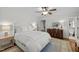 Serene bedroom with a plush bed, wood floors, and coordinated decor at 8000 N Bridgewater Ct, Raleigh, NC 27615