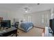 Bright bedroom with two large shuttered windows allowing natural light at 8000 N Bridgewater Ct, Raleigh, NC 27615