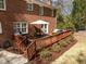 Wooden deck with outdoor dining and barbecue area at 8000 N Bridgewater Ct, Raleigh, NC 27615