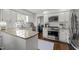 Bright kitchen with white cabinets, granite countertops, and stainless steel appliances at 8000 N Bridgewater Ct, Raleigh, NC 27615