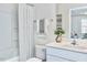 Clean bathroom with a shower-tub combo, a modern sink, bright lighting, and white and gray decor at 1007 Shovelhead Dr # 4, Durham, NC 27703