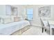 Bright bedroom features neutral decor, soft carpet, a window view, and modern artwork for a relaxing atmosphere at 1007 Shovelhead Dr # 4, Durham, NC 27703