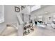Inviting entryway with stairs, stylish console table, and an open view to the adjacent light-filled living space at 1007 Shovelhead Dr # 4, Durham, NC 27703