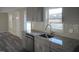 Updated kitchen with new gray cabinetry, a backsplash, and granite countertops at 912 Martin Luther King Jr Dr, Smithfield, NC 27577