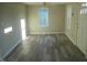 Open-concept living area boasting new vinyl floors and fresh neutral paint throughout at 912 Martin Luther King Jr Dr, Smithfield, NC 27577