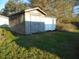 Property view of a rustic wooden storage shed in the backyard at 912 Martin Luther King Jr Dr, Smithfield, NC 27577