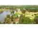 Stunning aerial view of a golf course, lake and surrounding community at 917 Queensferry Rd, Cary, NC 27511