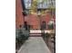 View of backyard featuring brick exterior, well-manicured landscaping and beautiful deck, perfect for entertaining at 917 Queensferry Rd, Cary, NC 27511