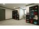 Finished basement features carpeted floors, built in shelves and ample room for to play at 917 Queensferry Rd, Cary, NC 27511