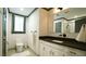 Well-lit bathroom featuring a toilet, vanity with dark countertop, and modern fixtures at 917 Queensferry Rd, Cary, NC 27511